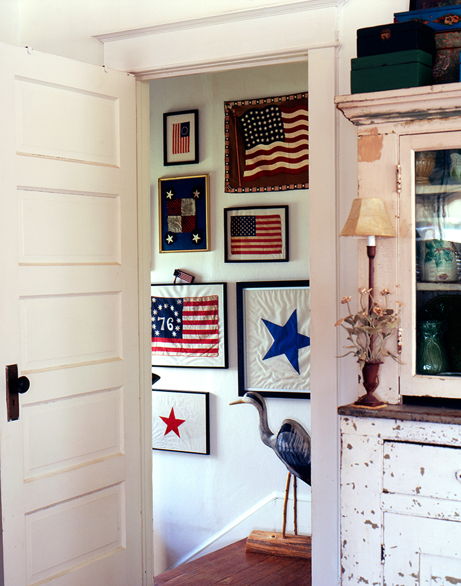saris with flags on wall