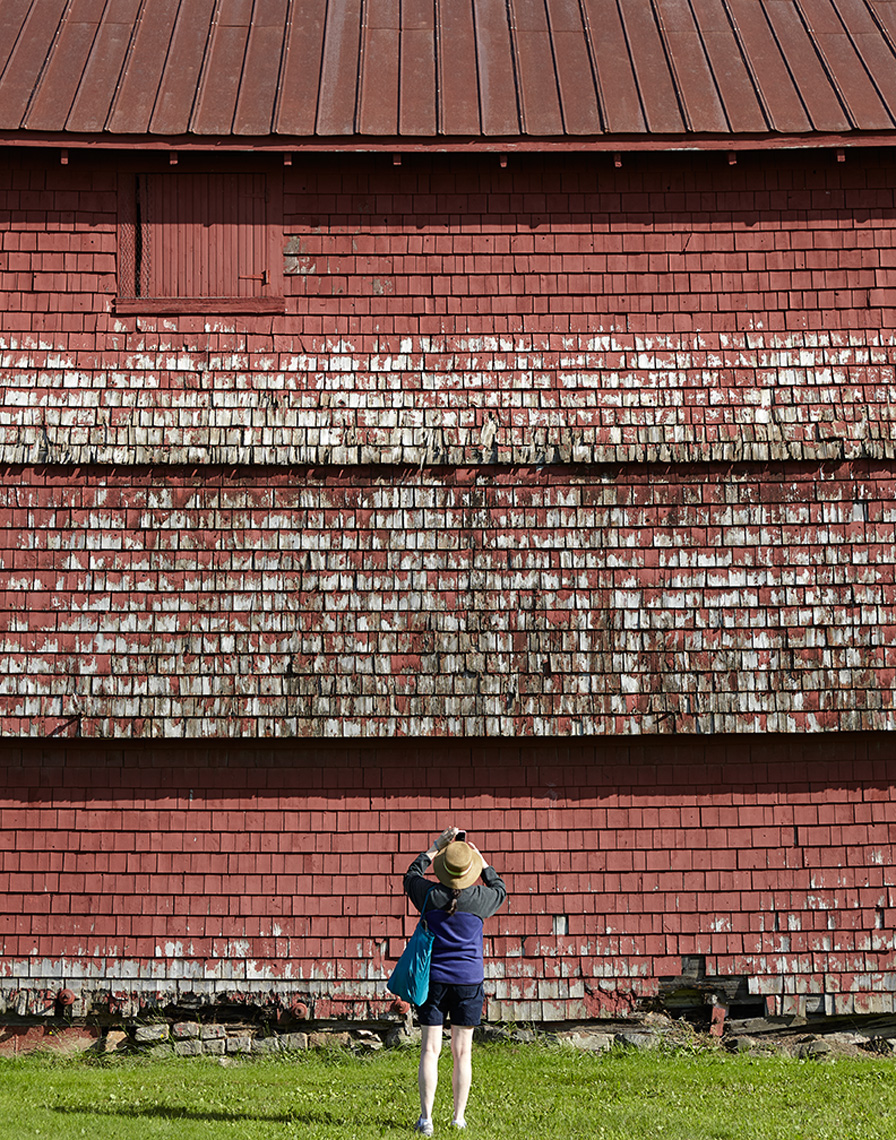 woman photographing distressed red bad belfast maine