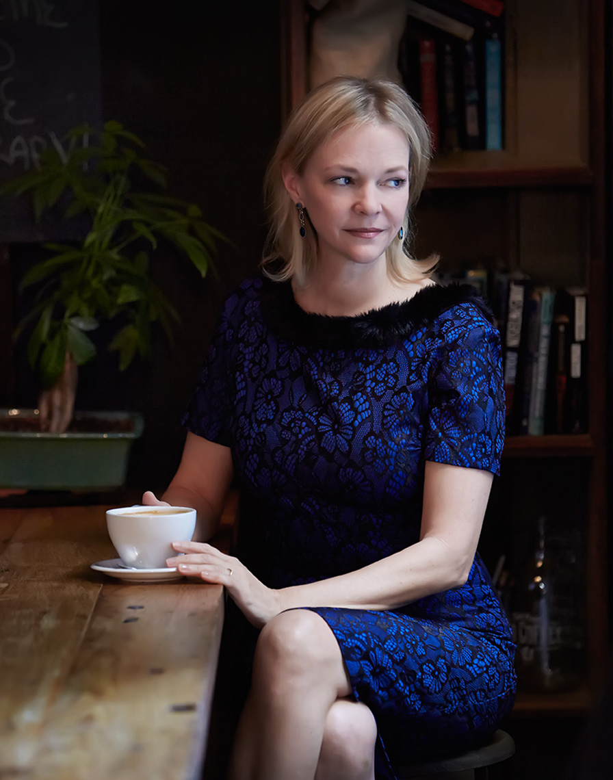 blond woman amy_schiebe author in blue dress