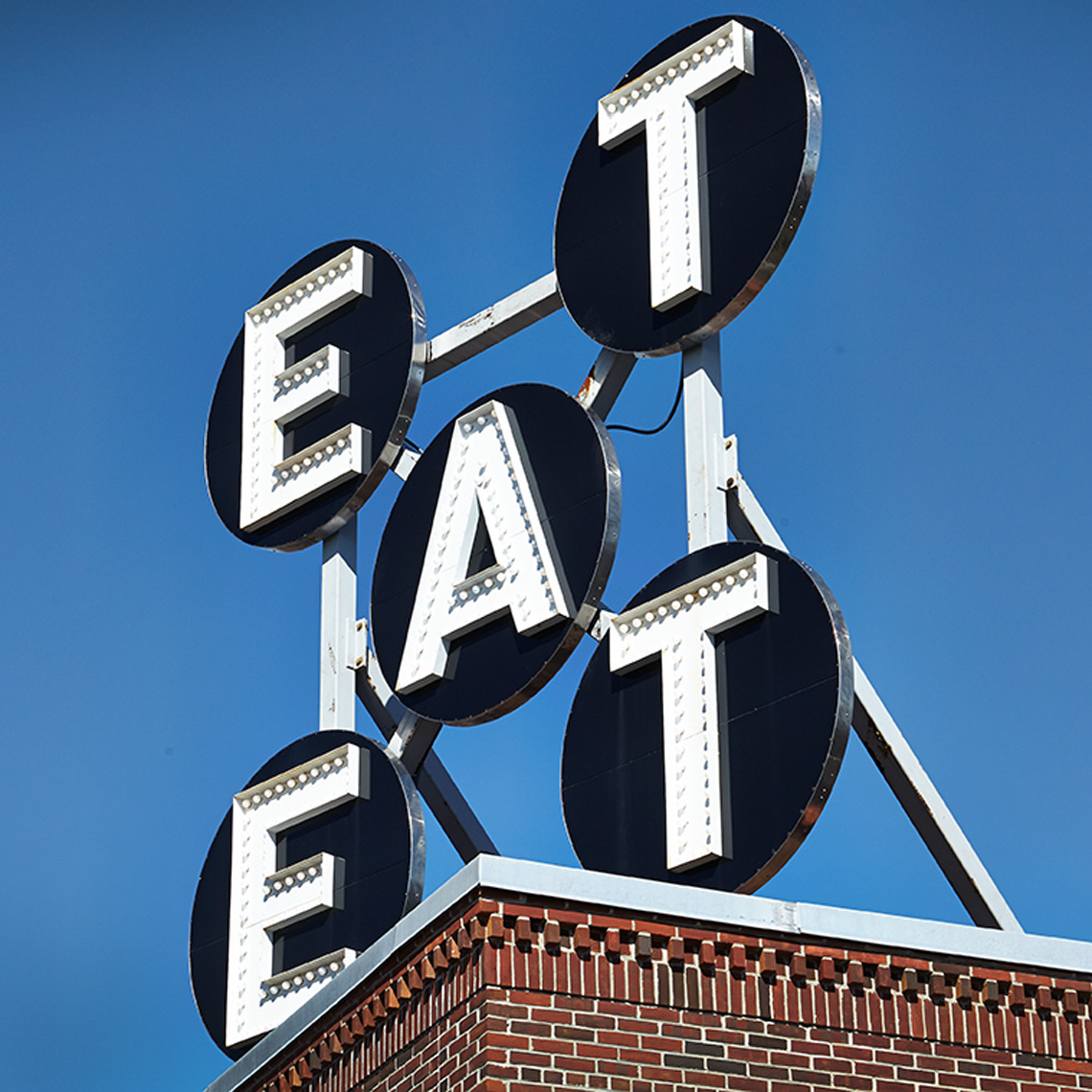 eat sign blue sky