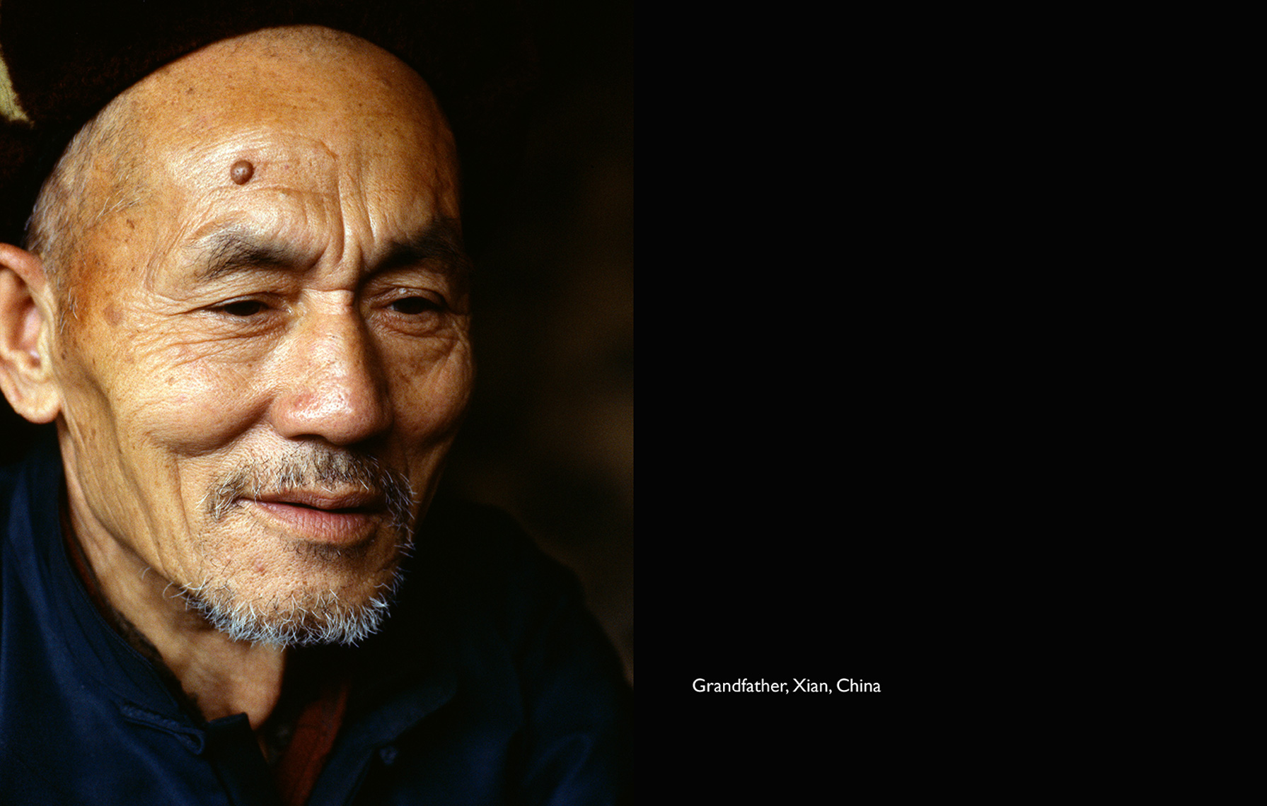 old chinese man with blue shirt