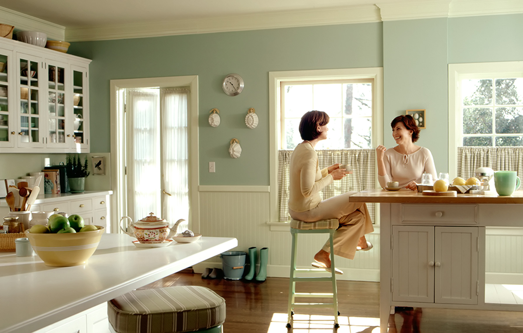 women in kitchen talking